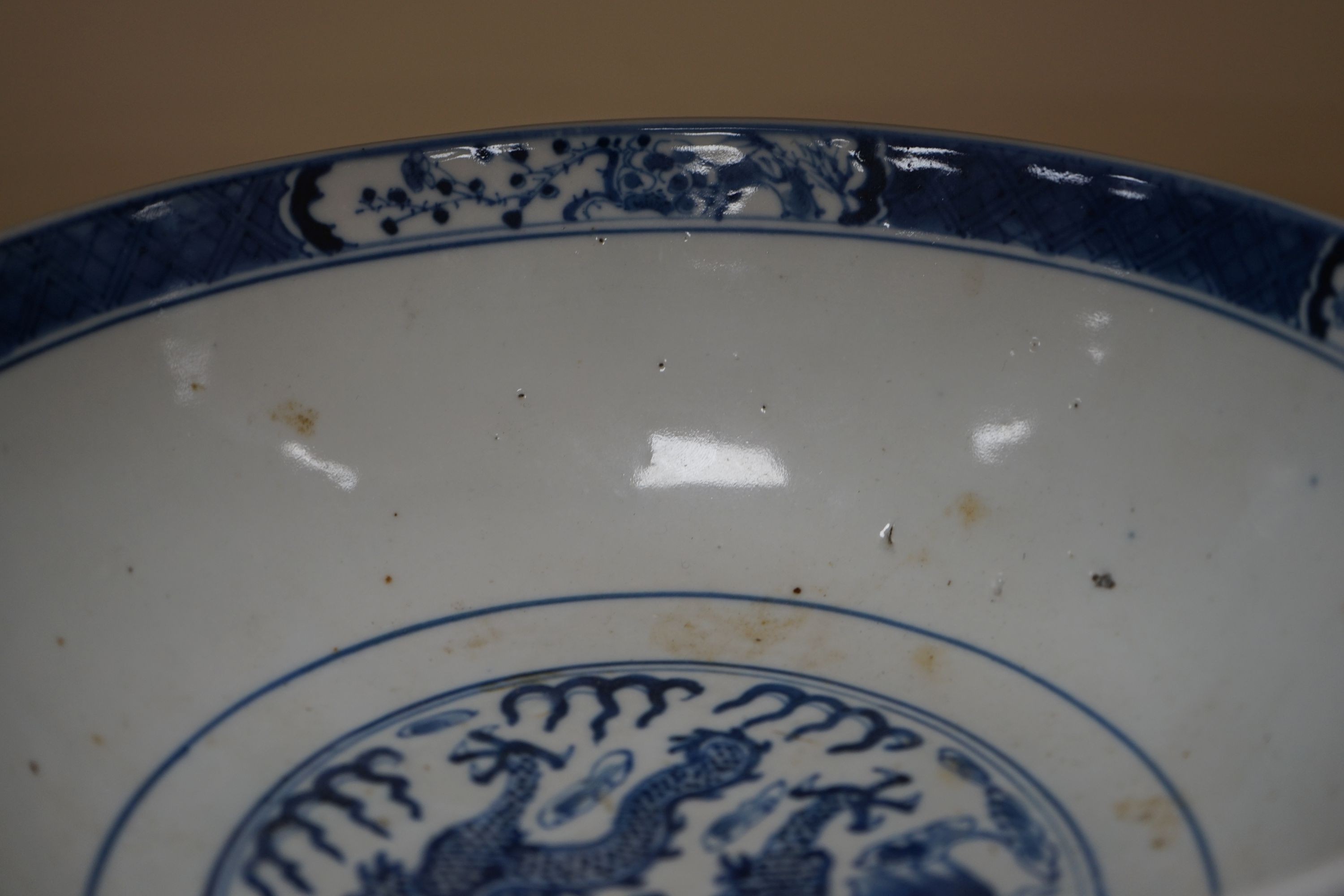 A Chinese blue and white ‘dragon’ bowl, Kangxi mark, late 19th century 25cm